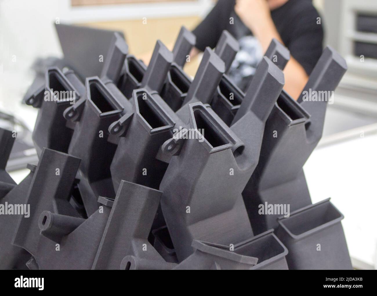 Black model printed on 3D printer in laboratory office. Object printed ...