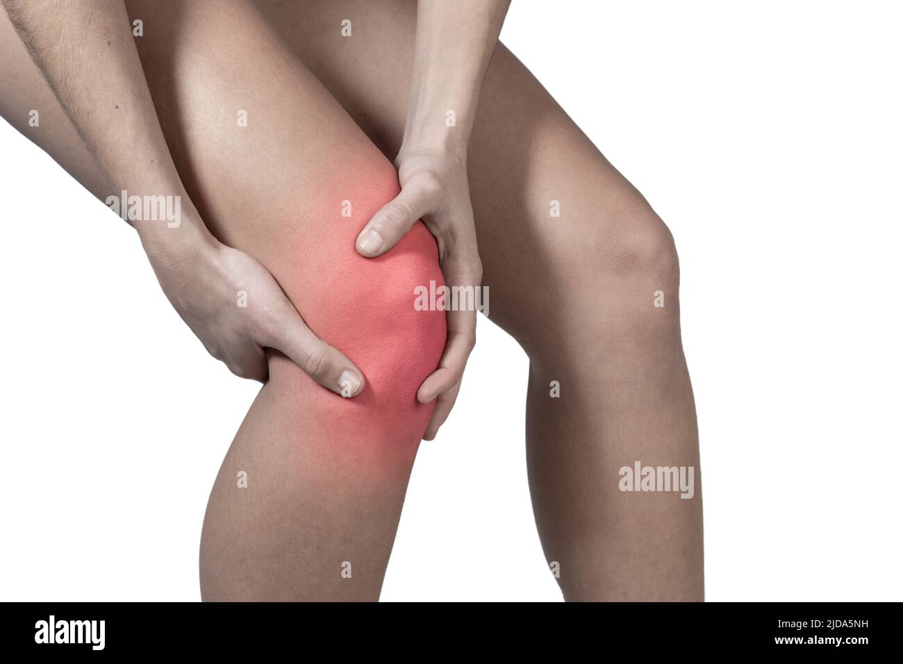 Knee pain with hands covering it. Lateral view Stock Photo