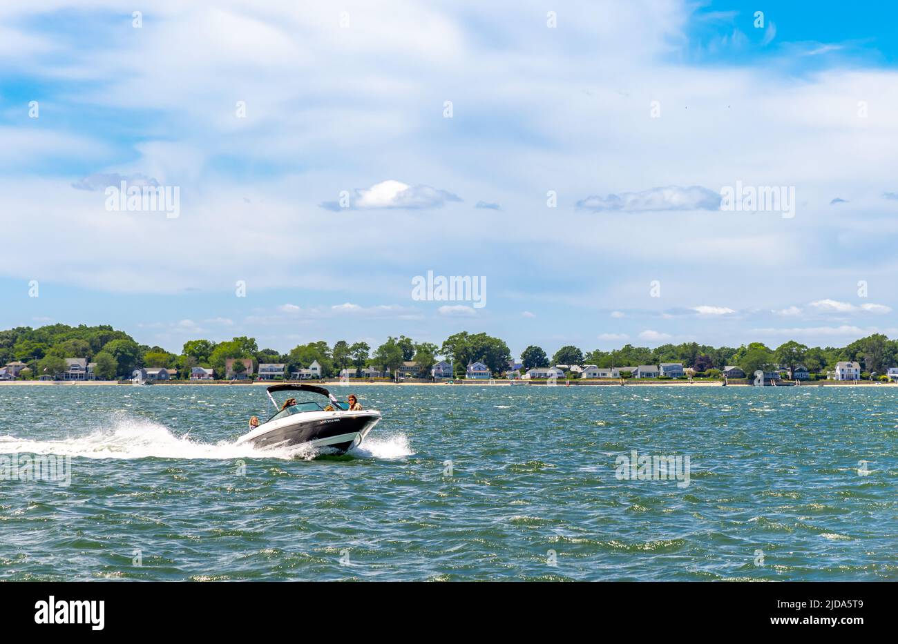 Four women in a power boat Stock Photo