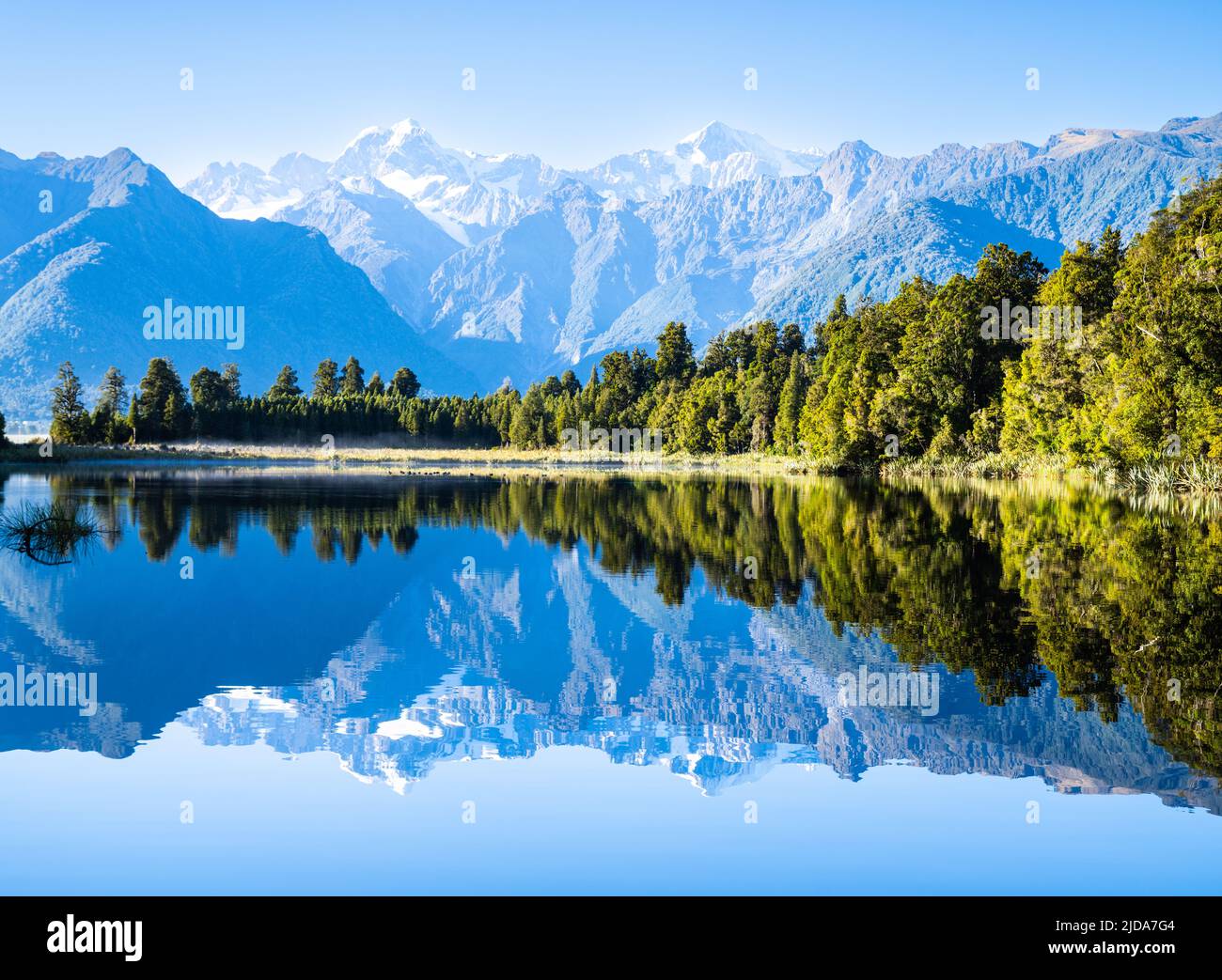 Perfect reflection in Lake Matheson surrounded by beautiful natural