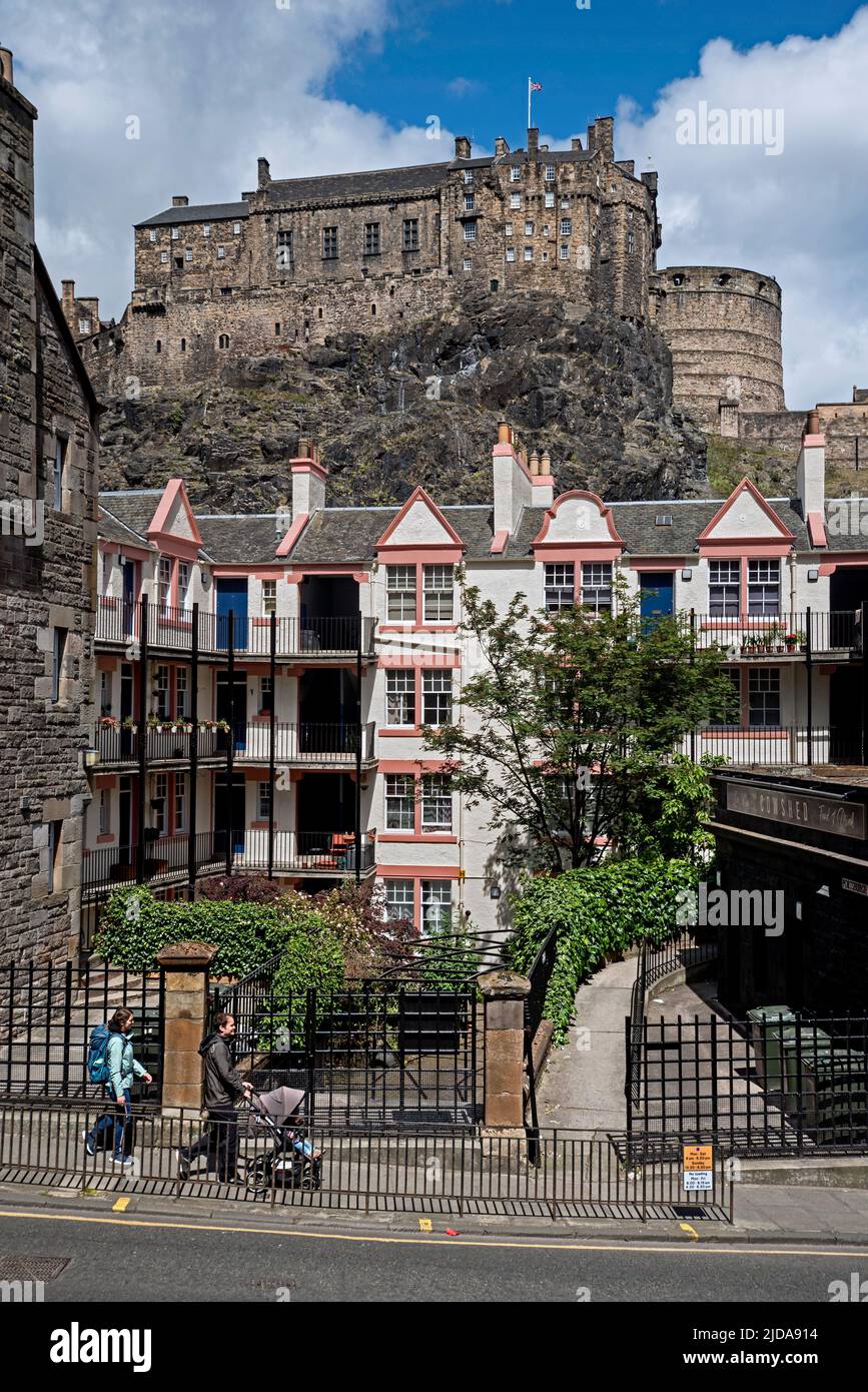 Portsburgh Square (early council housing built around 1900) and Edinburgh Castle photographed from West Port in the Old Town. Stock Photo