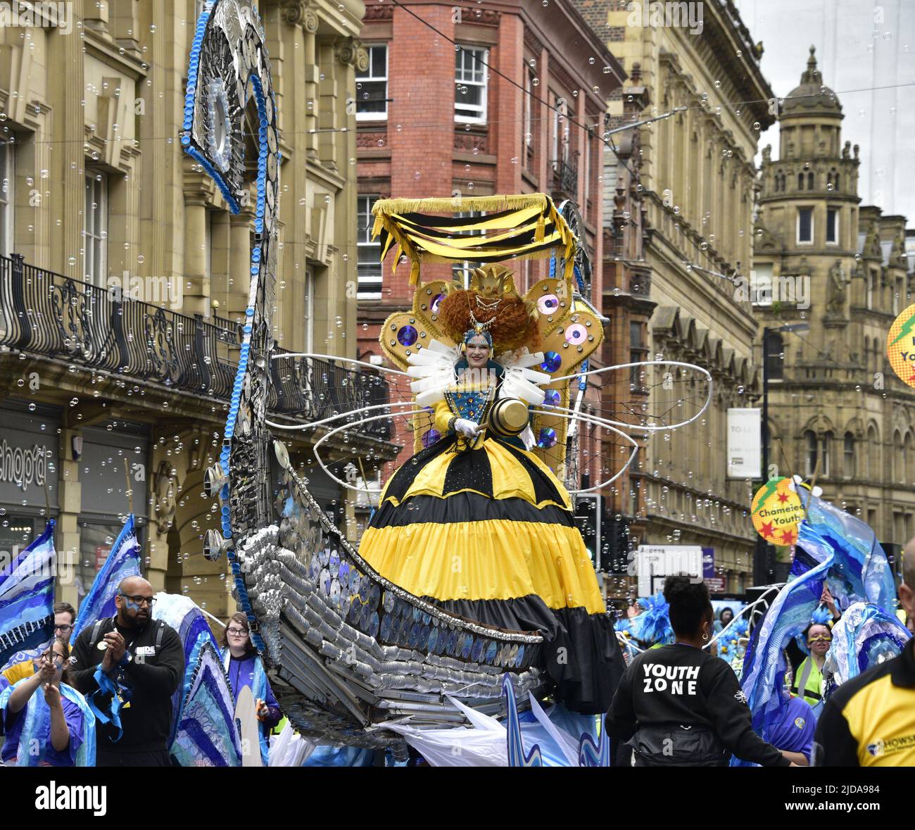 Manchester, UK, 19th June, 2022. The Queen Bee float. Performers and artists take part in the Manchester Day Parade, Manchester, England, United Kingdom. Organisers say: "Over 1,500 performers and artists from local communities bring Manchester city centre to life in a fantastic display of colour, sound and movement. An audience of more than 60,000 are wowed by the incredible day of amazing structures, vibrant costumes and pulsating music and dance". Credit: Terry Waller/Alamy Live News Stock Photo
