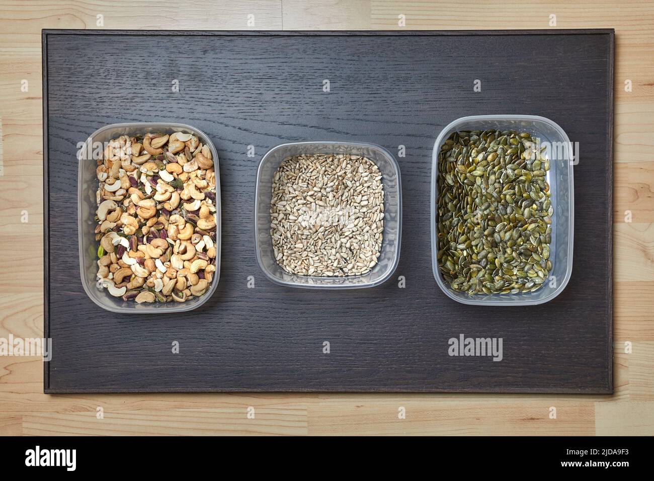Nuts and seed in boxes Stock Photo