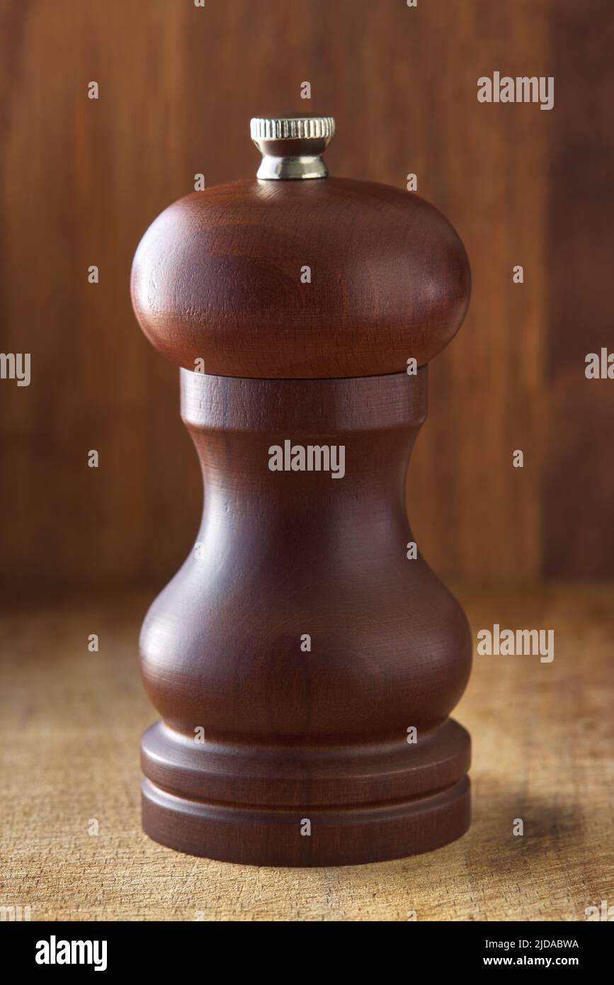 Wooden brown grinding salt shaker and pepper shaker on wooden rustic background Stock Photo
