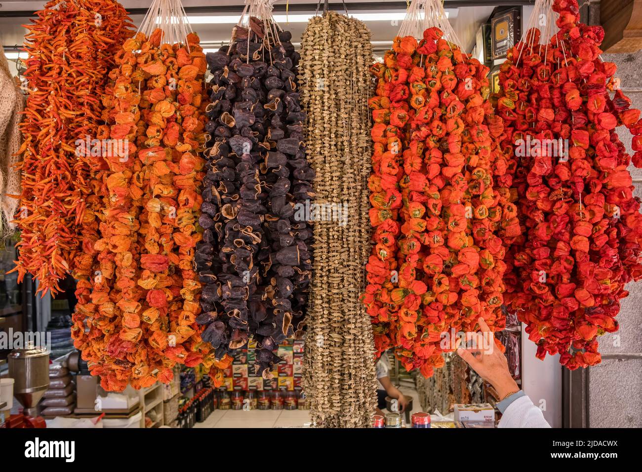 Dried bell peppers, chillies, aubergins and okra hanging on the traditional turkish food market Stock Photo