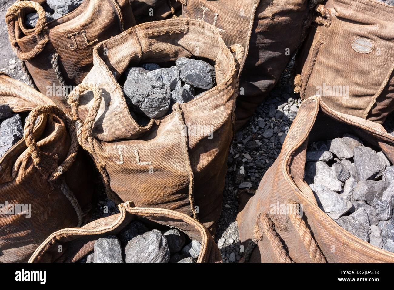 Canvas or jute sacks of coal. UK 2022 Stock Photo