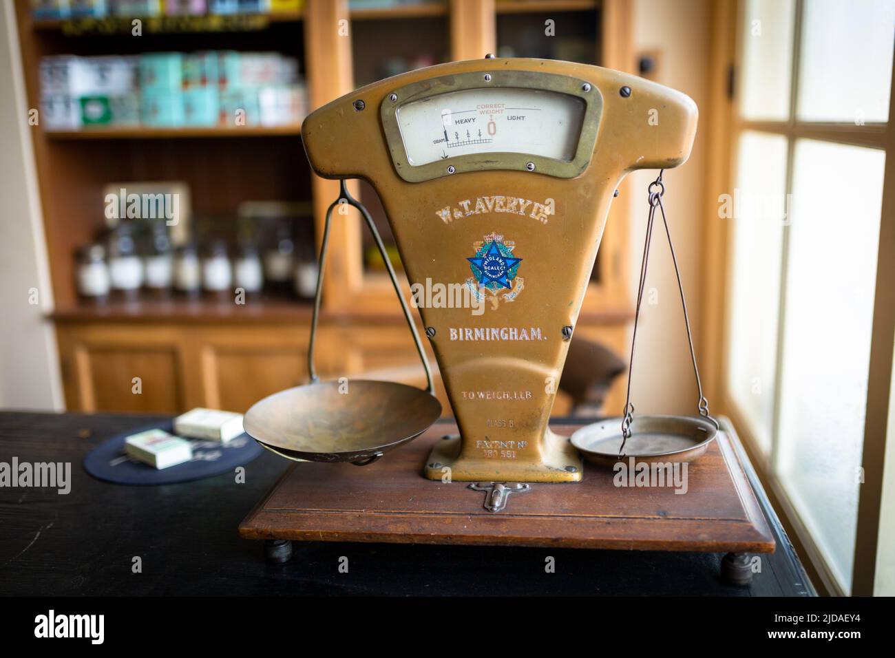 Old fashioned weighing scales in an old shop, UK 2022 Stock Photo Alamy