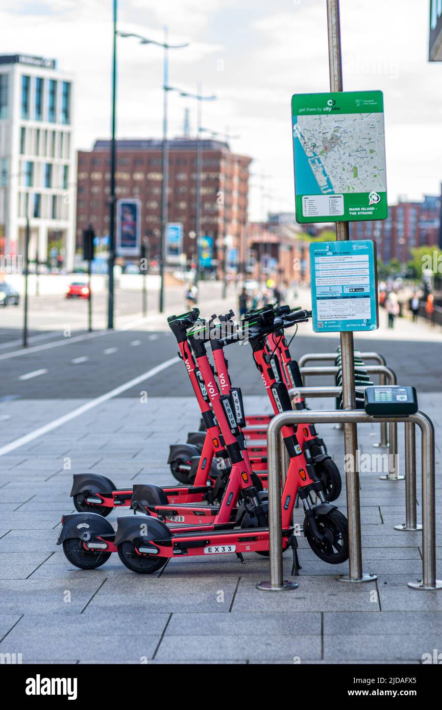 Voi E-scooters at Mann Island - The Strand bike station in Liverpool, England, UK Stock Photo