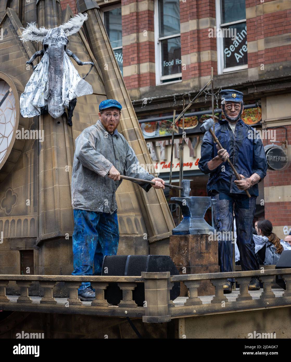 Manchester Day Parade, 19 June 2022: Worker hammering on an anvil Stock Photo