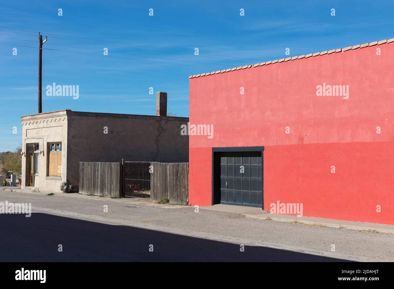 Empty buildings on Main Street, a warehouse with a red wall. Stock Photo