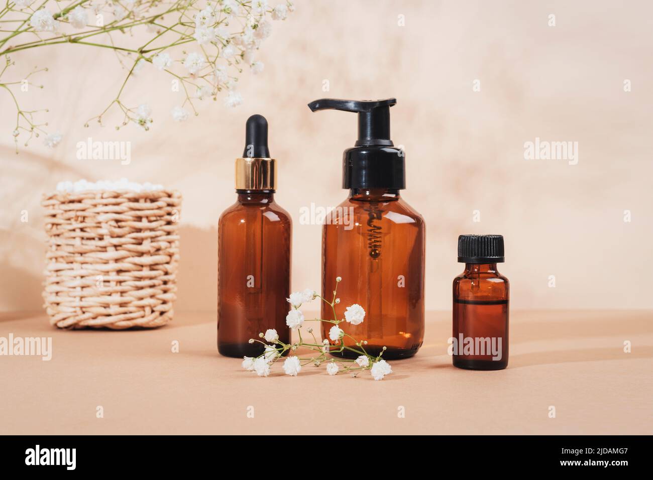 Cosmetic face cleanser, serum brown glass bottles, essential oil and