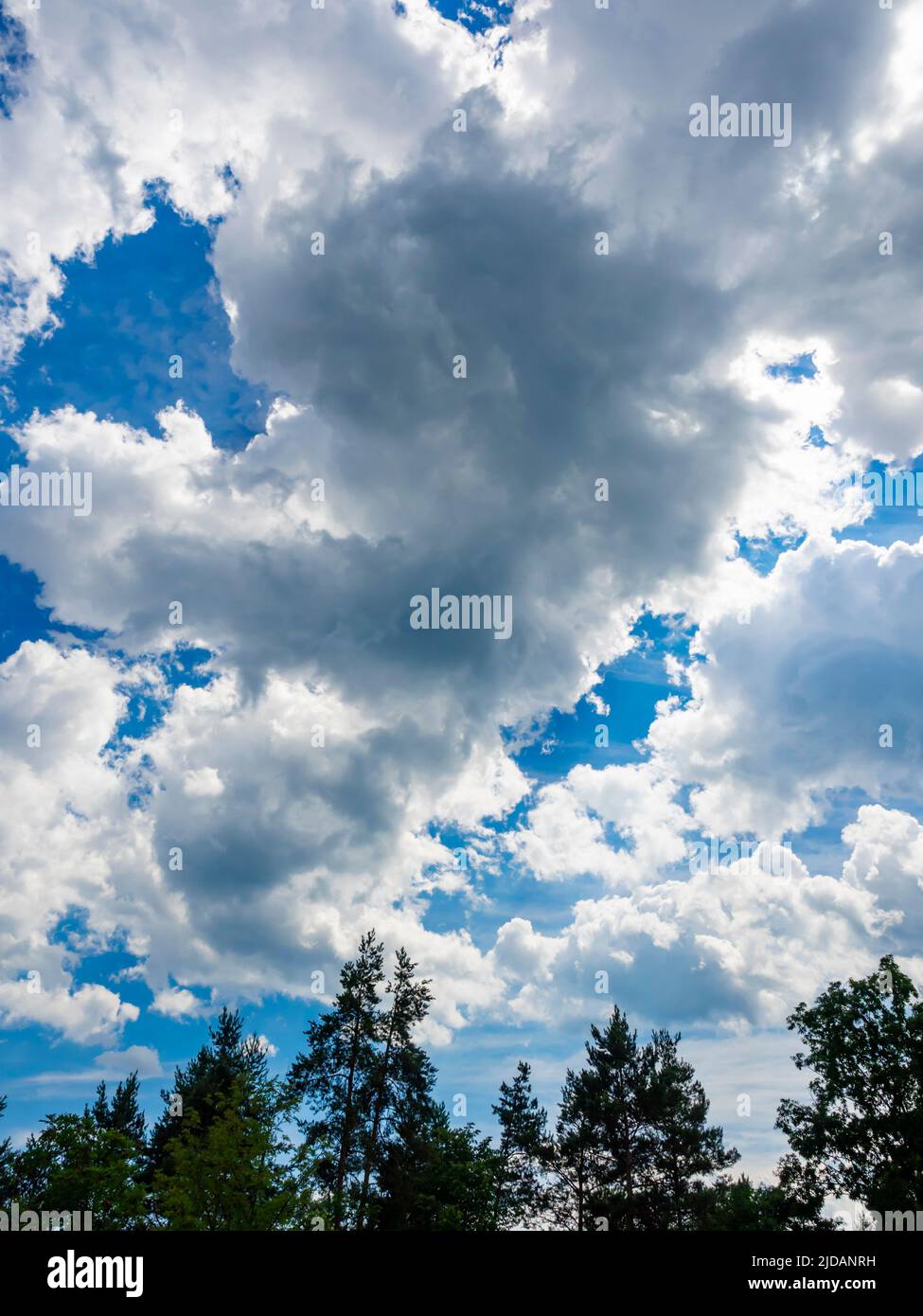 Fluffy clouds sunshine Blue sky Stock Photo