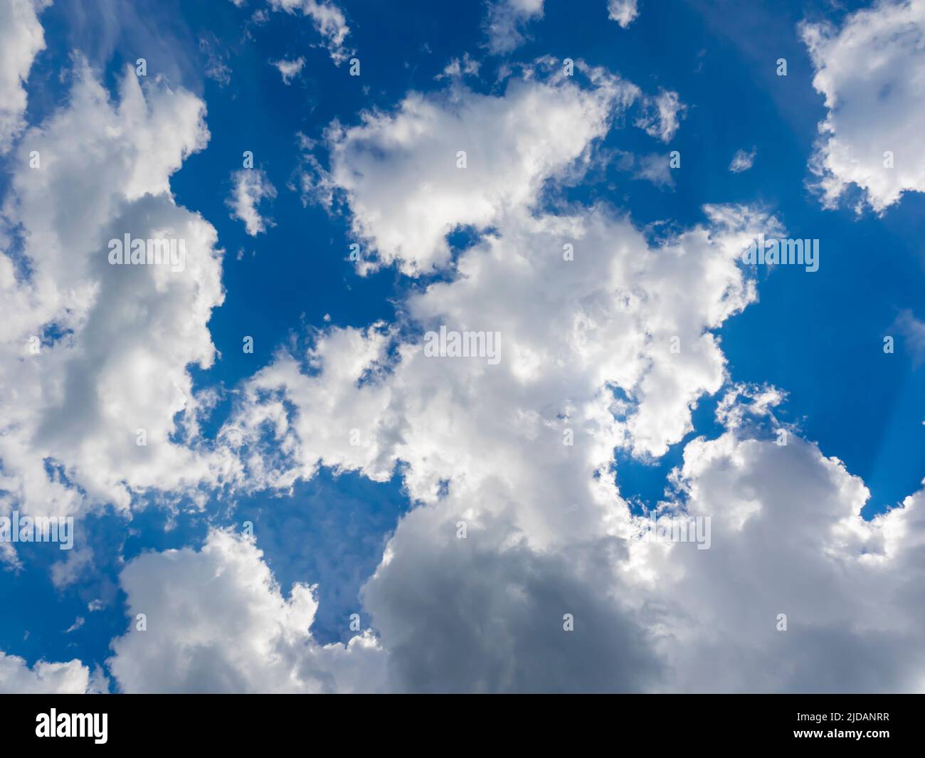 Fluffy only clouds sunshine Blue sky Stock Photo