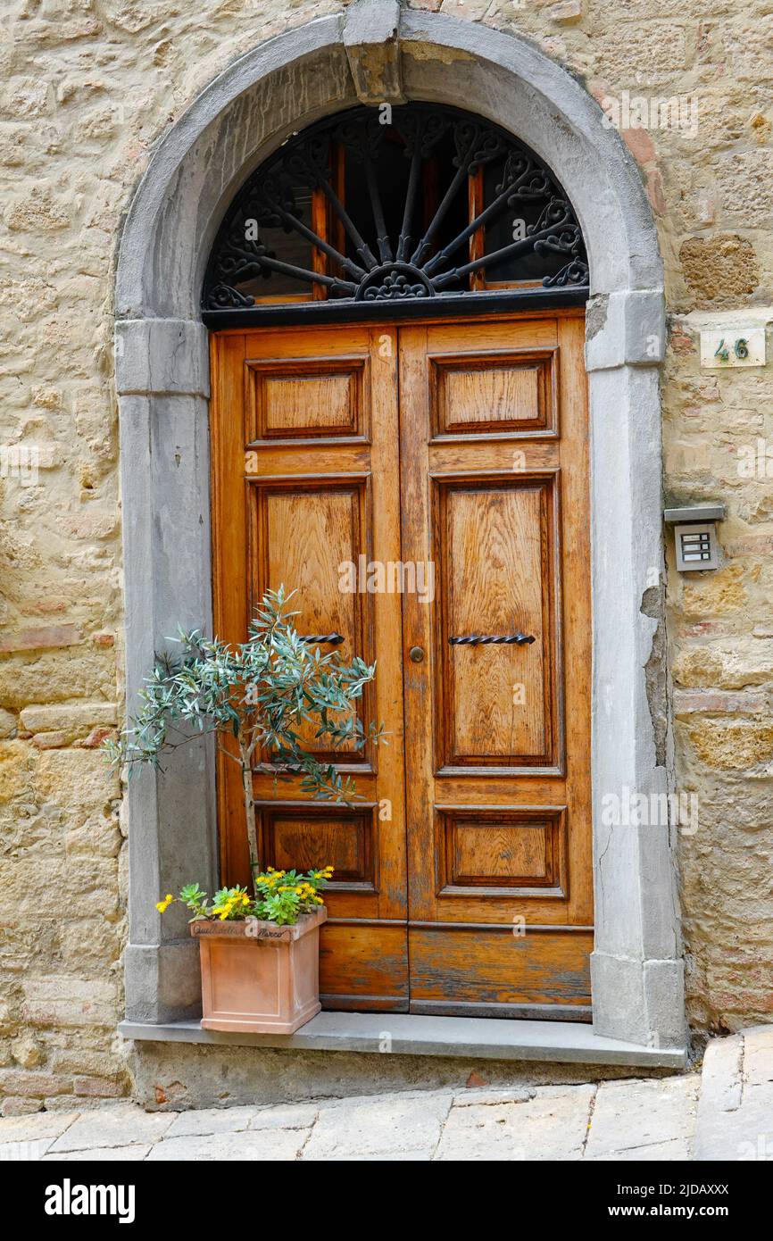 Elegant double doors to residence on Via Porta all'Arco, Province of Pisa, in the Tuscan hill town of  Volterra, Italy. Stock Photo