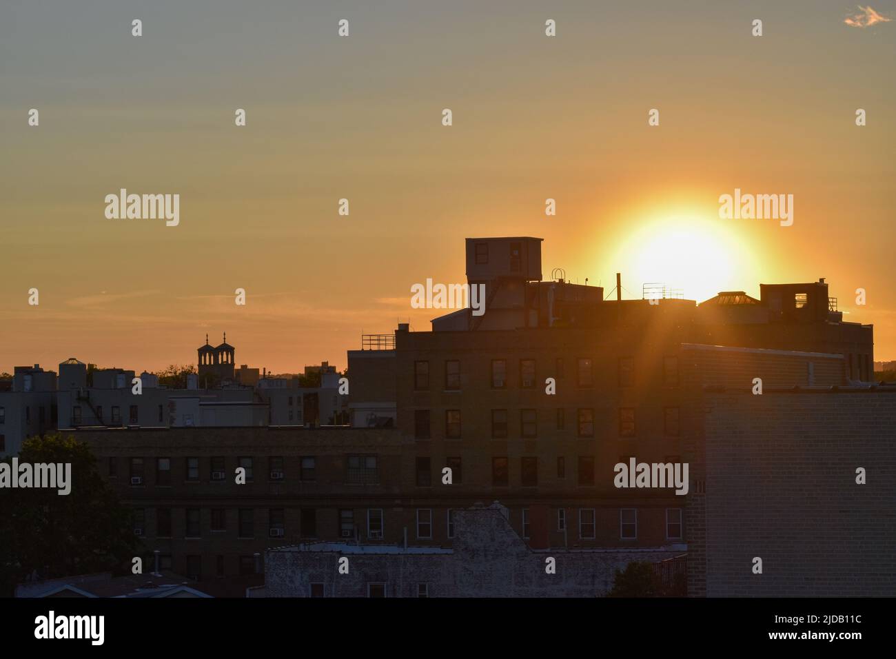 Sunset over a residential building is seen in The Bronx, New York City
