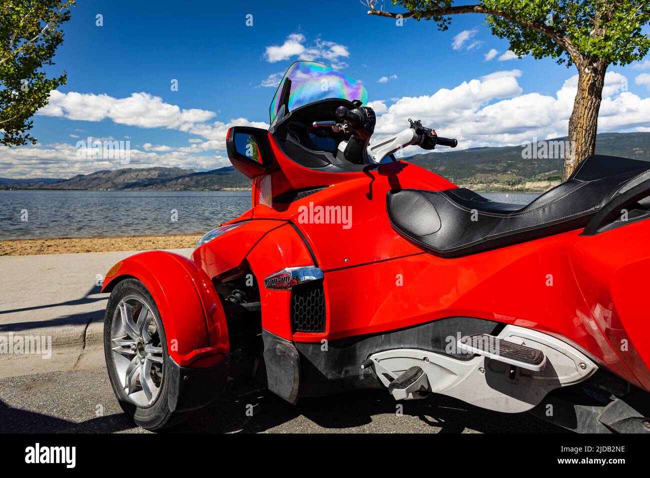 Roadster BRP Can-Am Spyder F3 on a background of the blue sky and mountains  at sunny summer day Stock Photo - Alamy