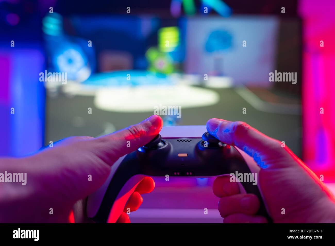 Gamer using controller to play online video games on computer. Man playing  game with joystick and headphones in front of monitor. Player having gaming  equipment, doing fun activity Stock Photo - Alamy