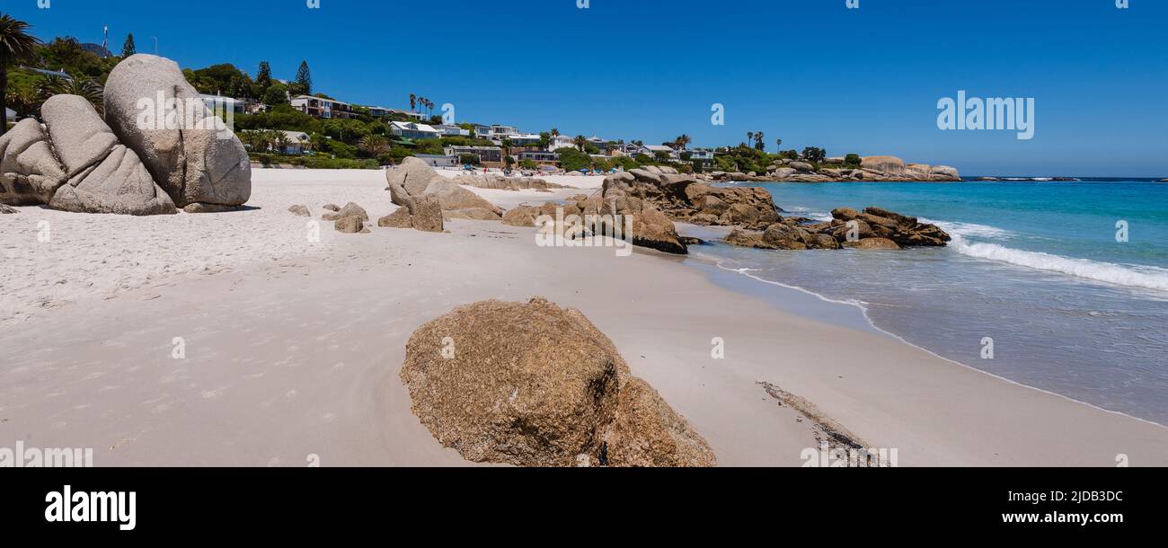 Beachfront homes and large boulders along the Atlantic Ocean at Clifton Beach; Cape Town