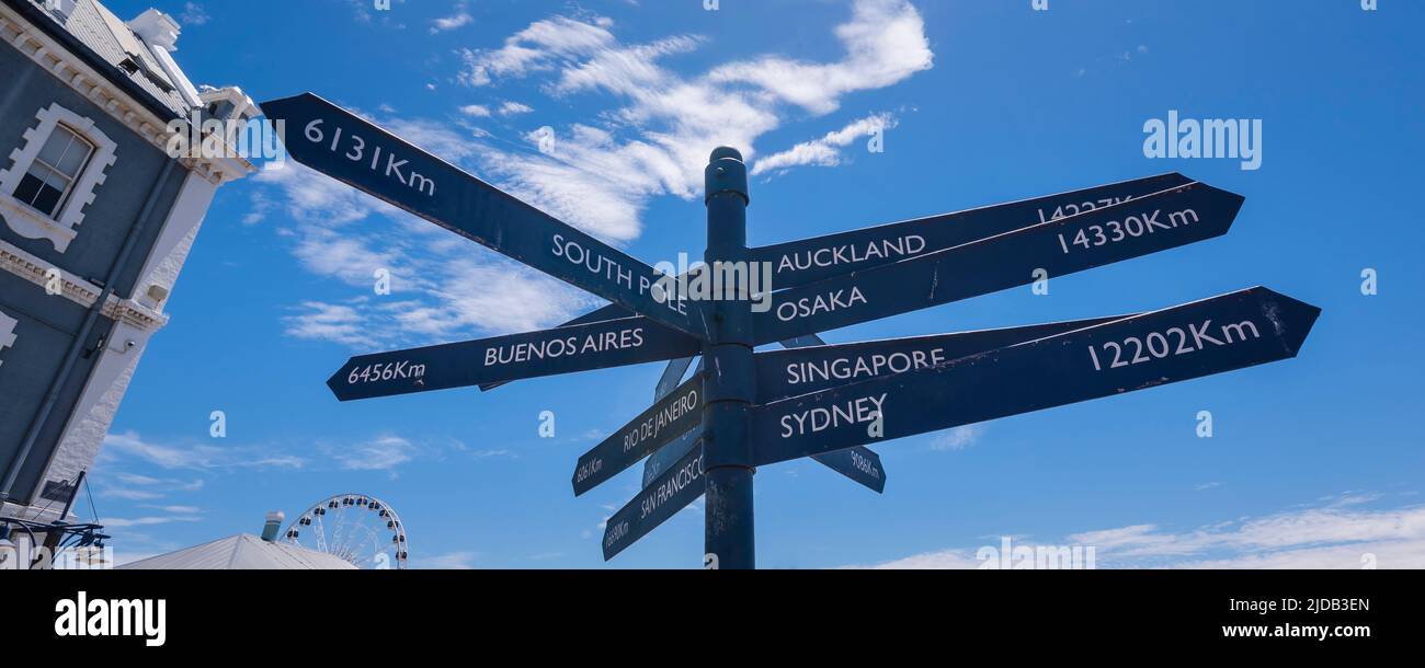 Sign Post, directional sign with the distance to various locations on the  Victoria and Alfred Waterfront in Cape Town Stock Photo
