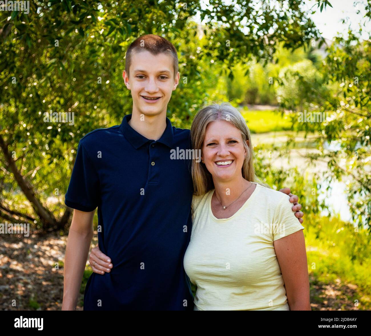 Outdoor portrait of a mother with her teenage son; Edmonton, Alberta, Canada Stock Photo