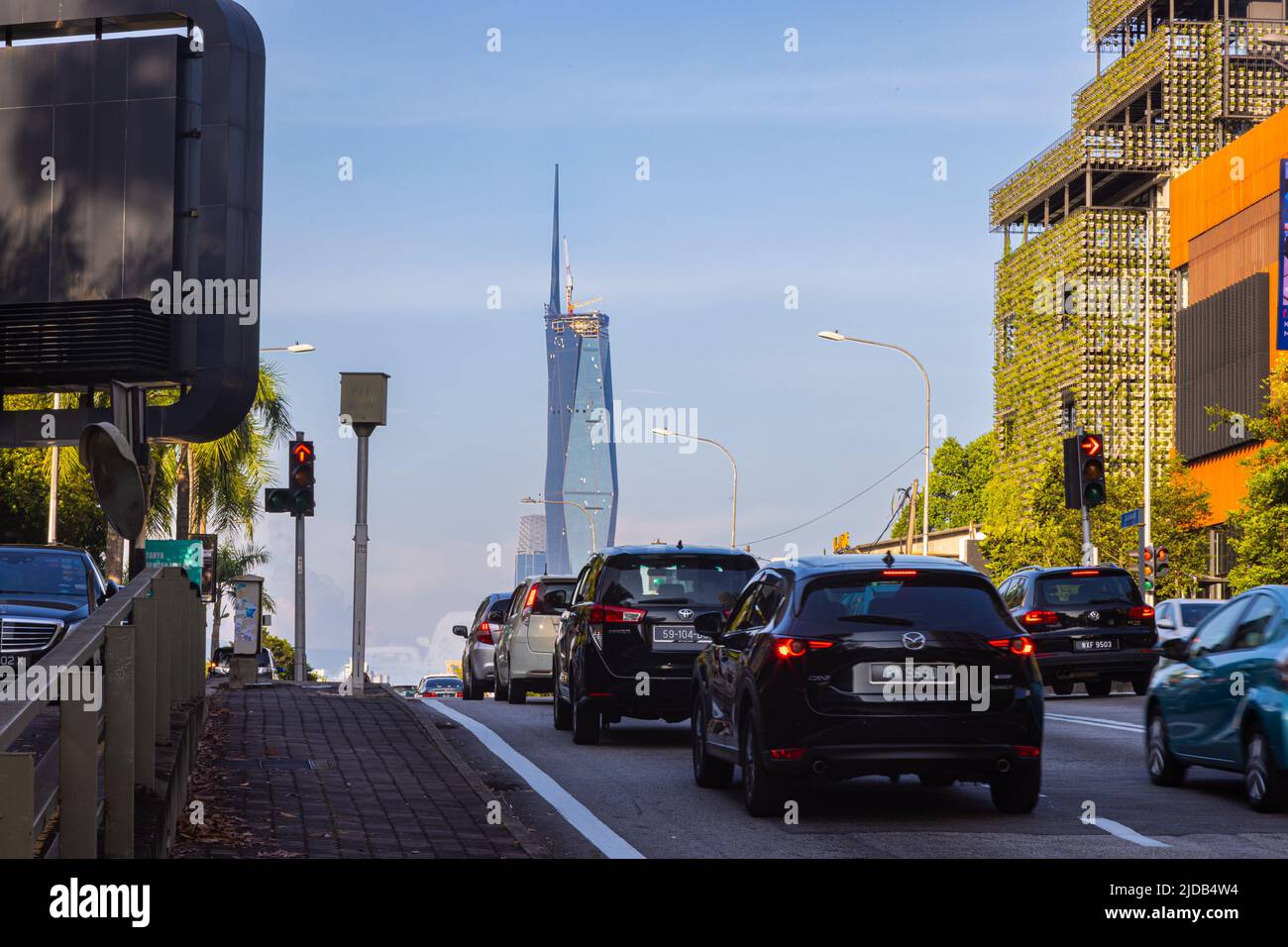 Kuala Lumpur, Malaysia - June 8, 2022: The new second tallest building in the world, Merdeka 118. The new icon behind a busy junction with high traffi Stock Photo