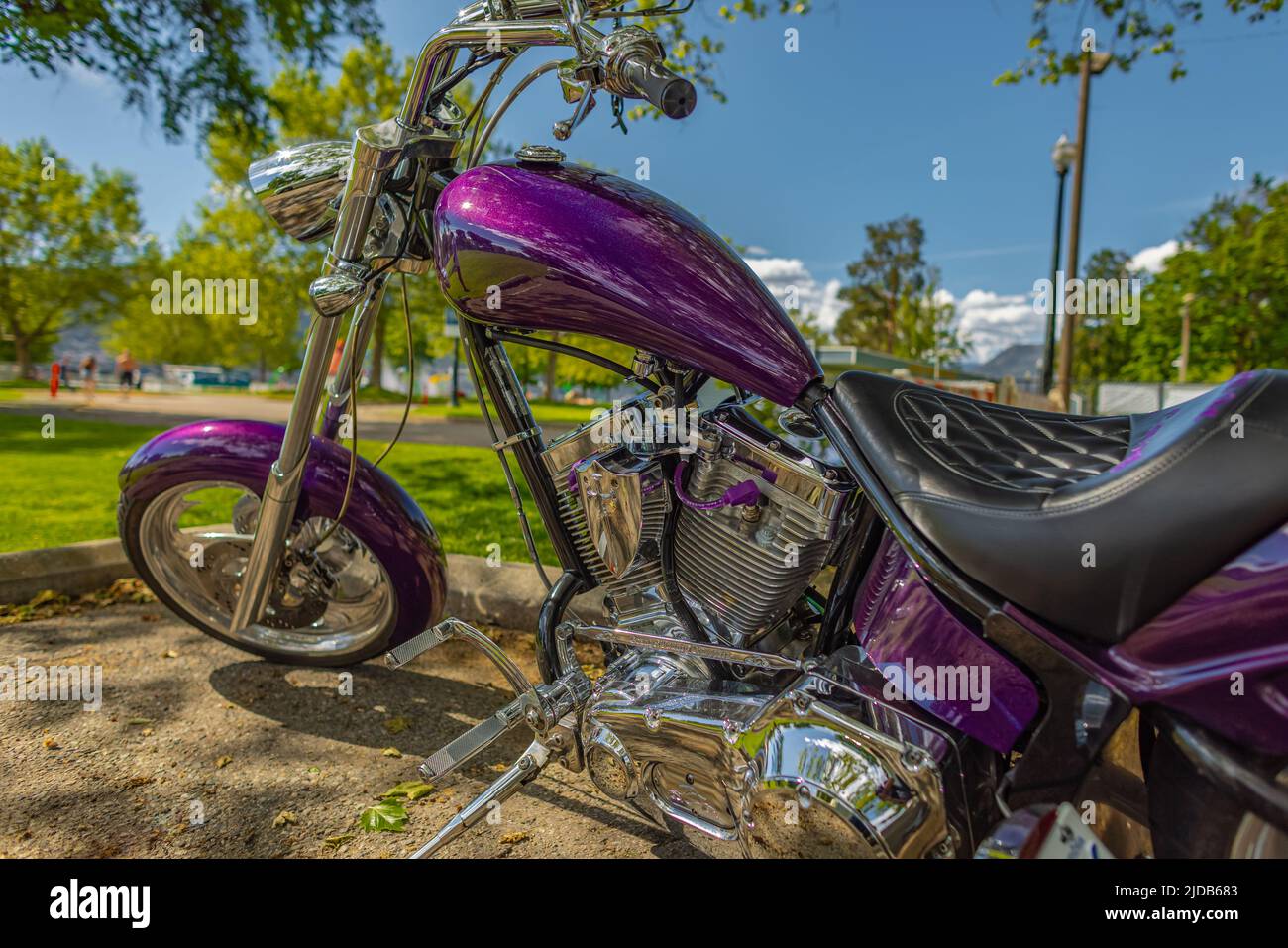 Purple custom chopper bike on a parking lot. Harley-Davidson Sportster. Harley Davidson motorcycles on the parking Stock Photo