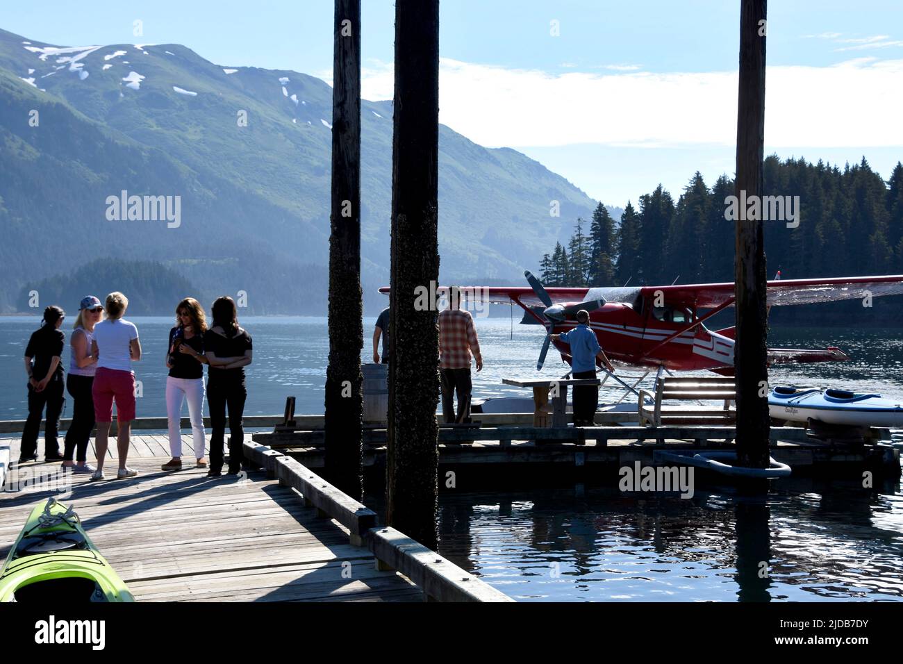 Guests at a lodge in Kachemak Bay wait for the arrival of a float plane to take them to their next destination in Alaska. Stock Photo