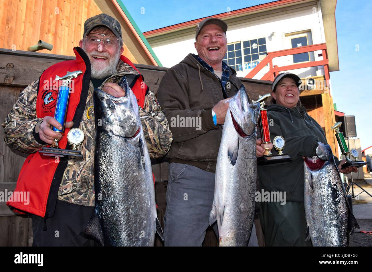 First through 3rd place winners in the 2018 Homer Winter King Salmon Tournament: Charlie Edwards, Jerry Huff and Janet Donnell. Stock Photo