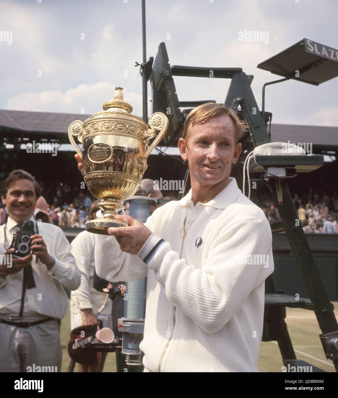 File photo dated 05-07-1968 of Australian Rod Laver with the trophy after he had beaten fellow Australian Tony Roche in the final. Many of the top players did not play at the grand slams for most of the 1960s after turning professional. When tennis ditched its amateur status, the sport came back together, and Australian great Rod Laver picked up where he left off by lifting the trophy again. Issue date: Monday June 20, 2022. Stock Photo