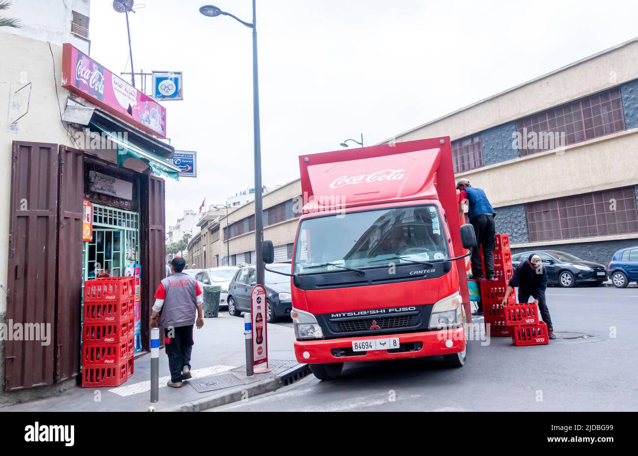 coca-Cola truck unloading, workers delivering Coca Cola to the retail store in Casablanca, Morocco Stock Photo