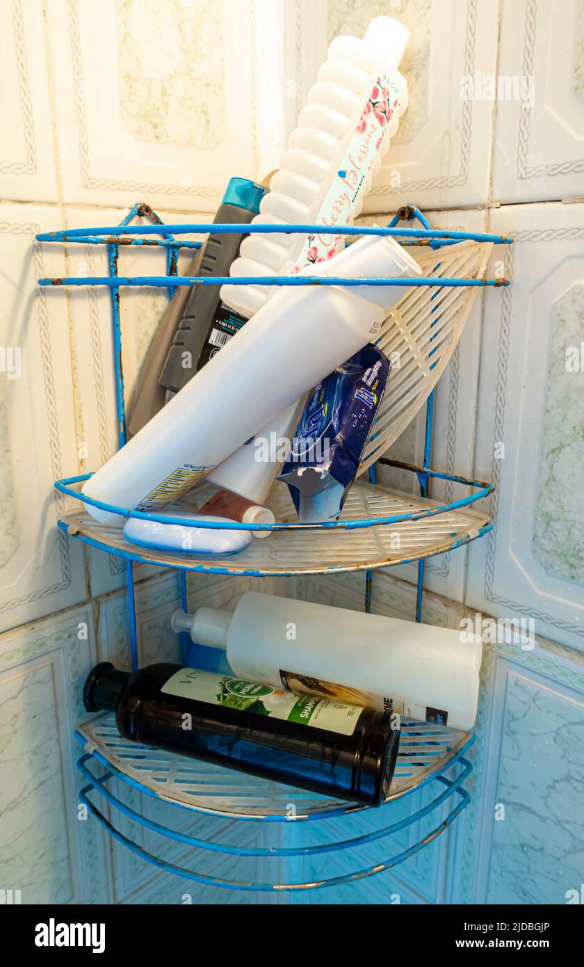 Assorted gels shampoo bottles in a shower simple corner Stock Photo
