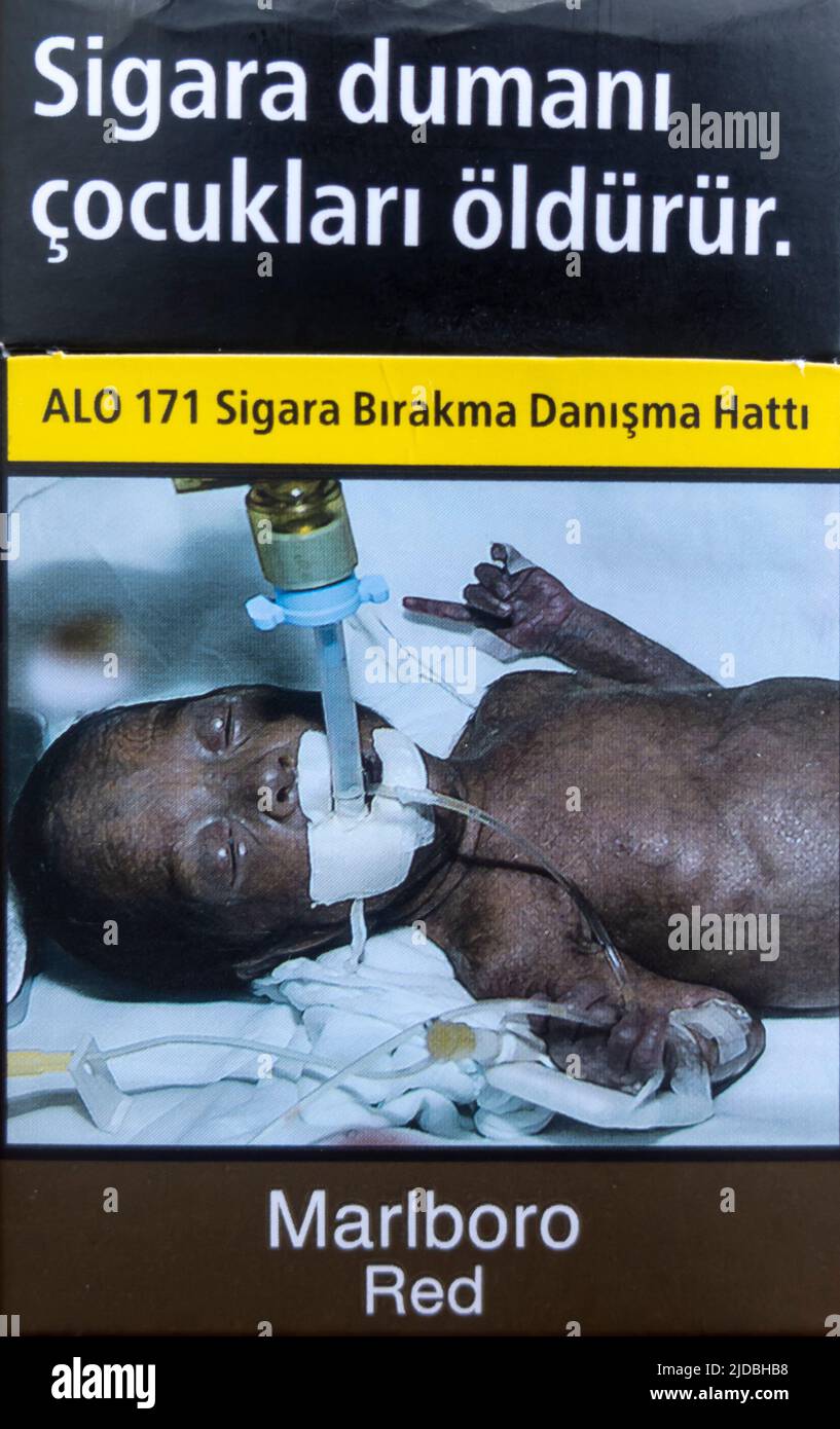 marlboro red - Turkish edition - pack of cigarettes. opened . Warning on a cigarette pack showing sick dying black baby Stock Photo