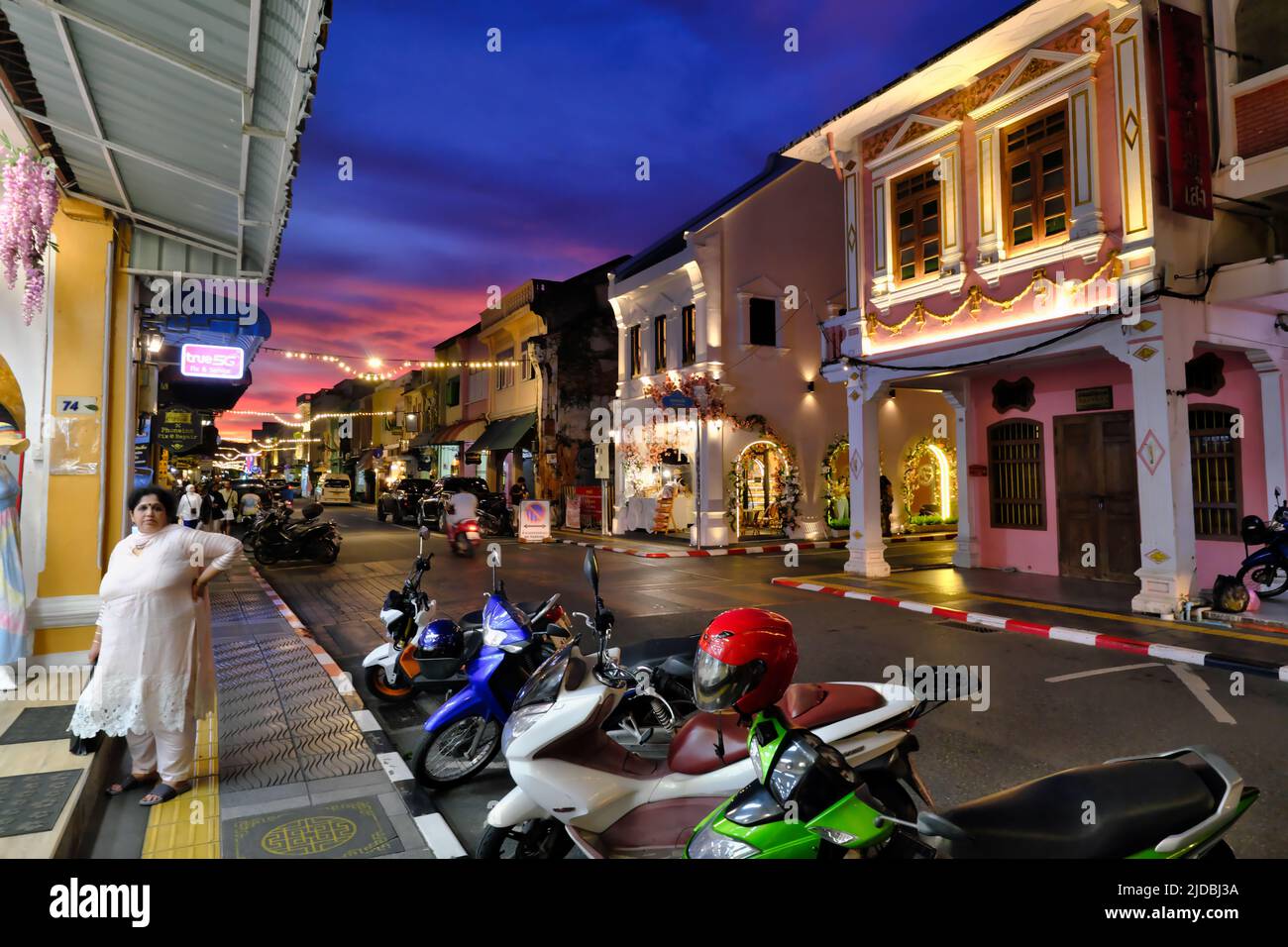 Dusk falls on the picturesque Sino-Portuguese or Peranakan shophouses in Thalang Road in the Old Town heritage area of Phuket Town, Phuket, Thailand Stock Photo