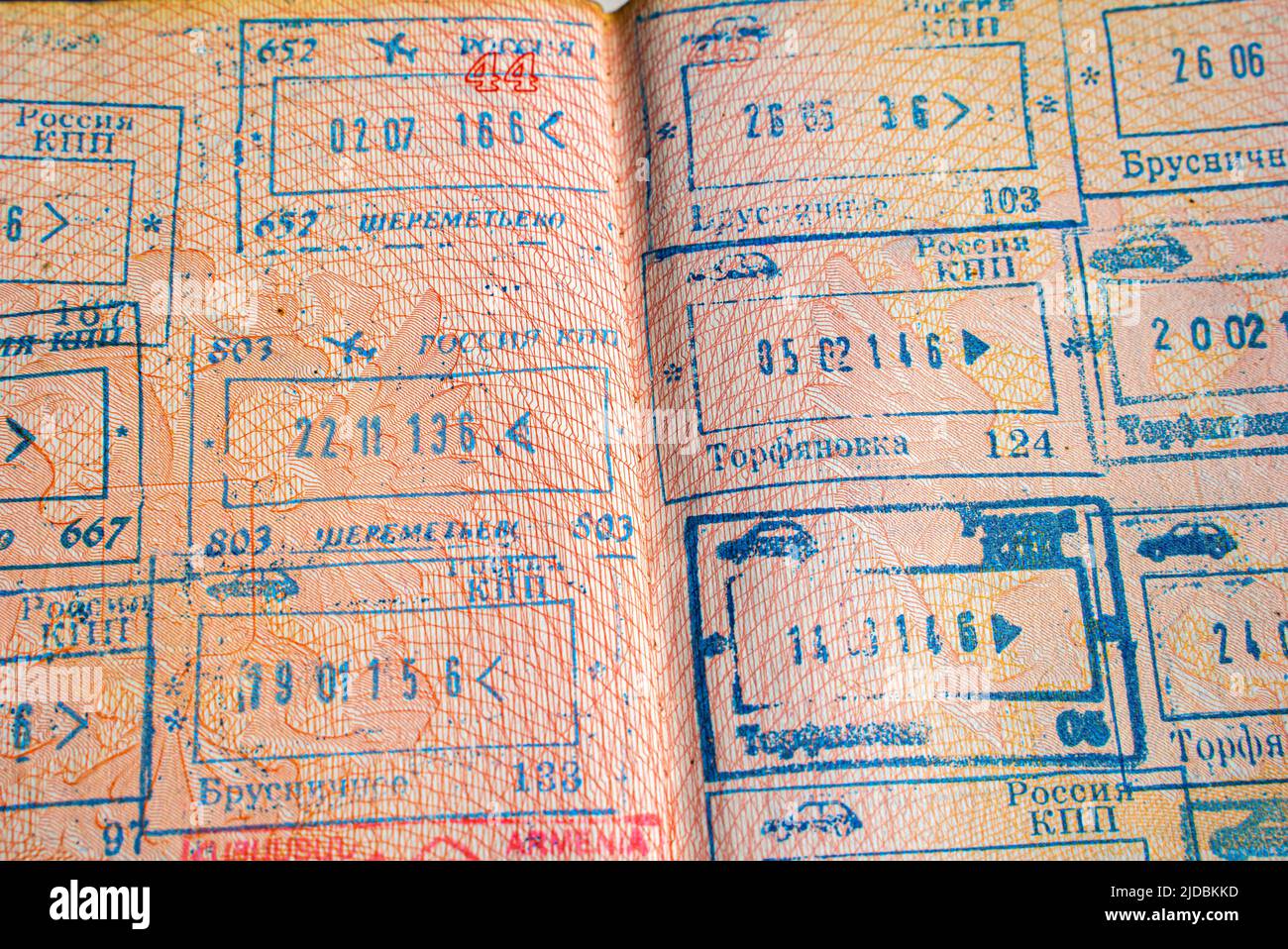 Border crossing stamps with names of the Russian border points in an open Russian passport Stock Photo