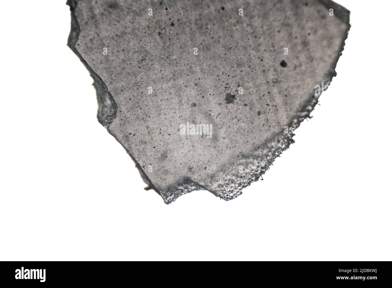 fragment of hybrid ceramic used in dentistry, macro photo using a microscope Stock Photo