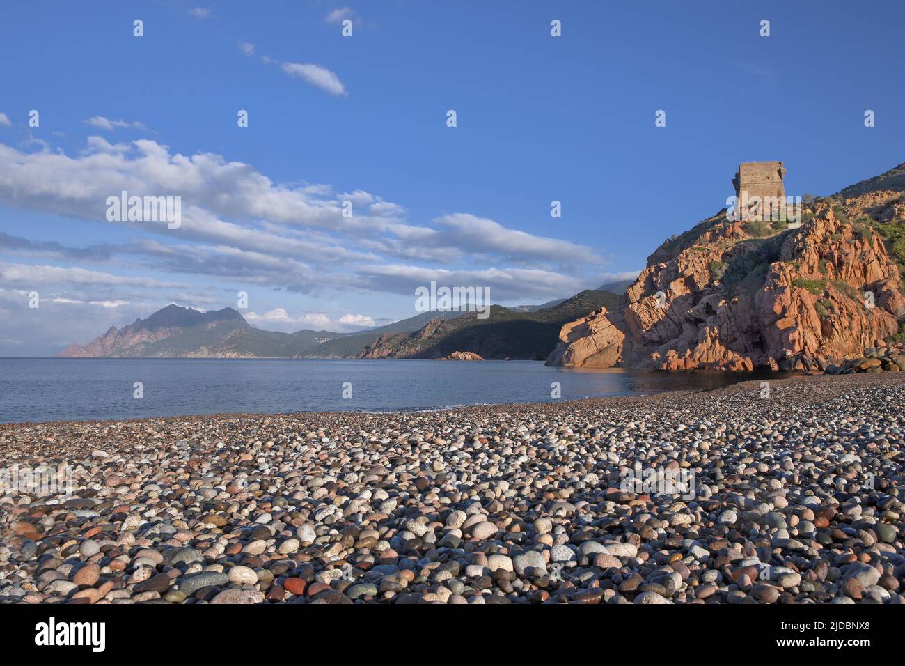 France, Corsica Gulf of Porto, the Genoese tower from the pebble beach Stock Photo