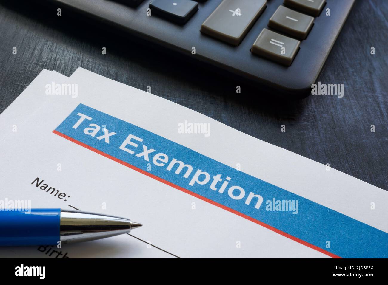 Empty Tax exemption application and a calculator. Stock Photo