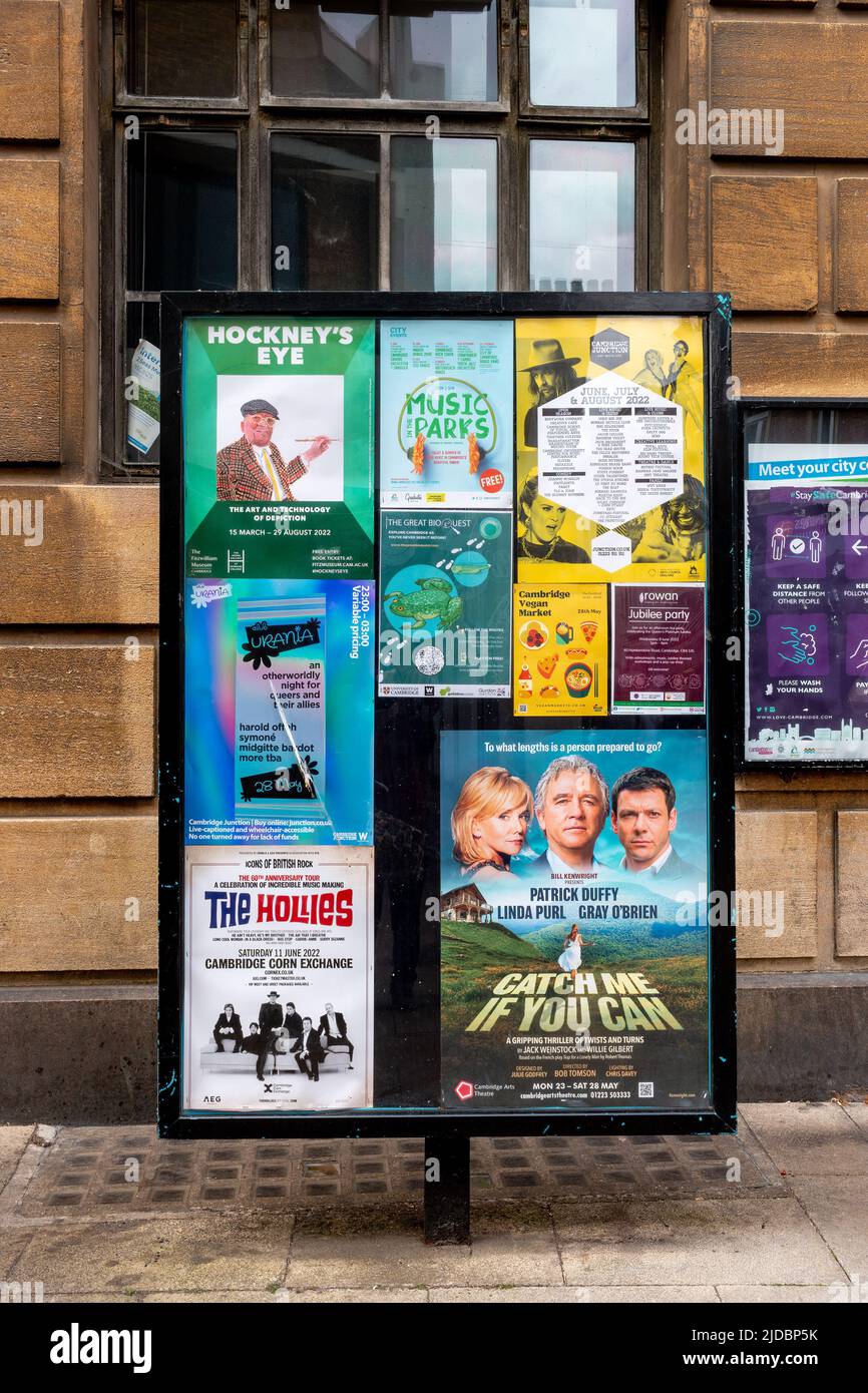 A noticeboard in Cambridge, UK, showing the advertisements for theatre, music and art shows. Stock Photo