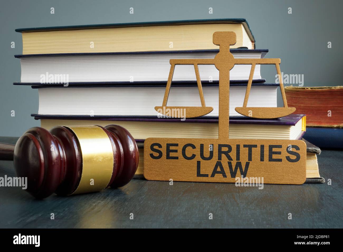Securities law tablet, gavel and stack of books. Stock Photo