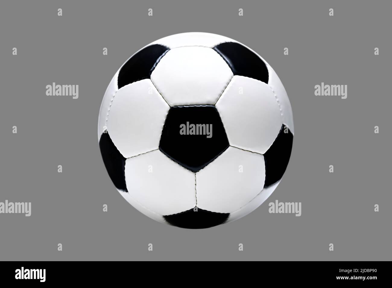 Soccer ball in front of grey background Stock Photo