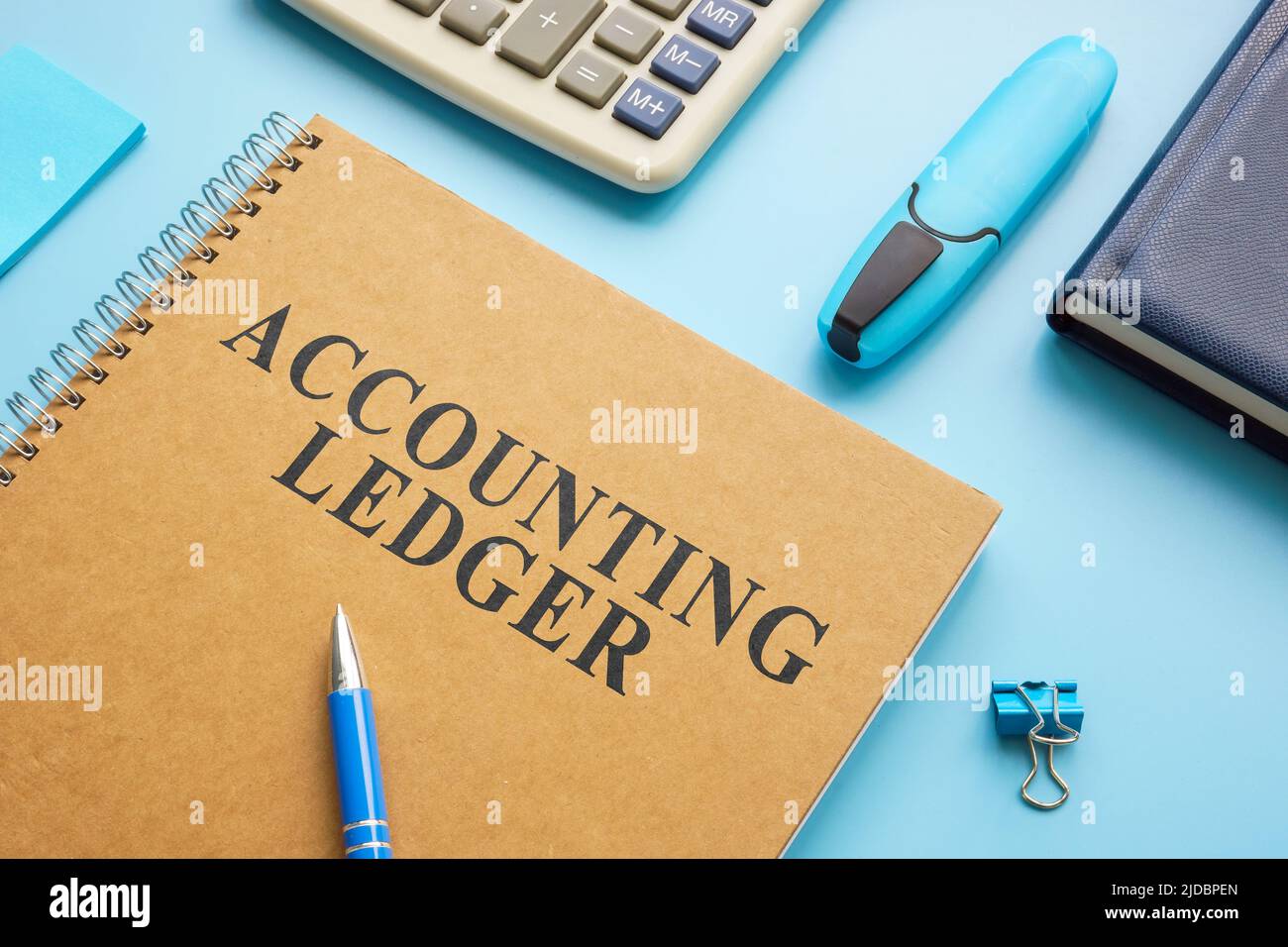 Accounting ledger, notepad and calculator on the desk Stock Photo Alamy