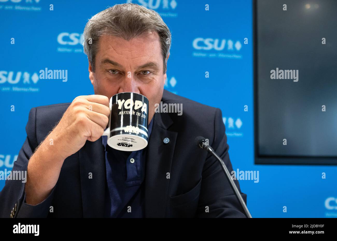 Munich, Germany. 20th June, 2022. Markus Söder, chairman of the CSU and prime minister of Bavaria, attends a meeting of the CSU executive board at party headquarters. Söder is holding a mug with the inscription 'Yoda - Master of the Jedi'. Credit: Sven Hoppe/dpa/Alamy Live News Stock Photo