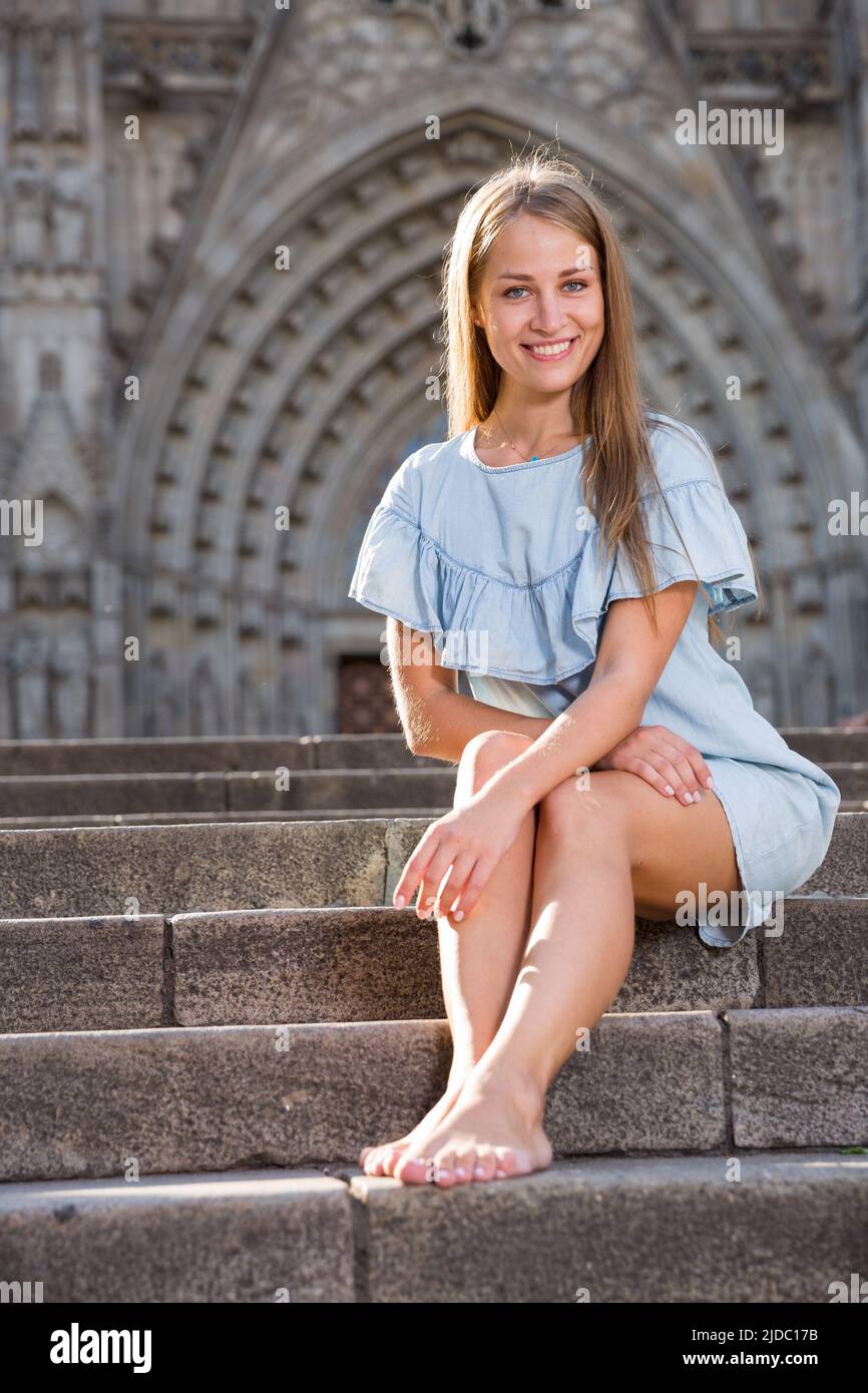 Girl sitting on stairs hi-res stock photography and images - Alamy