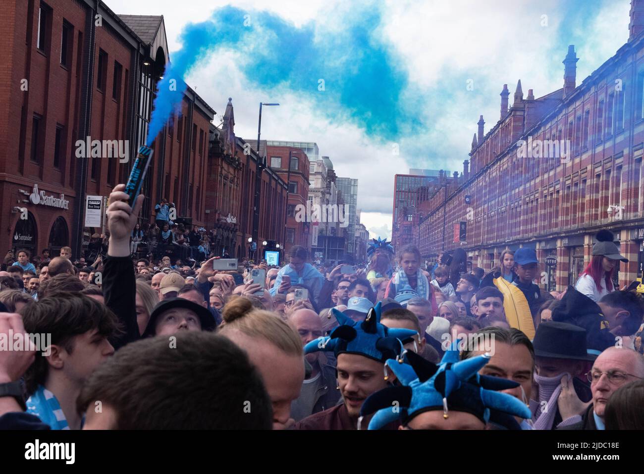 Crowds of fans celebrate Manchester City winning 4 Premier League titles in 5 years with an open top bus parade through the streets of Manchester Stock Photo