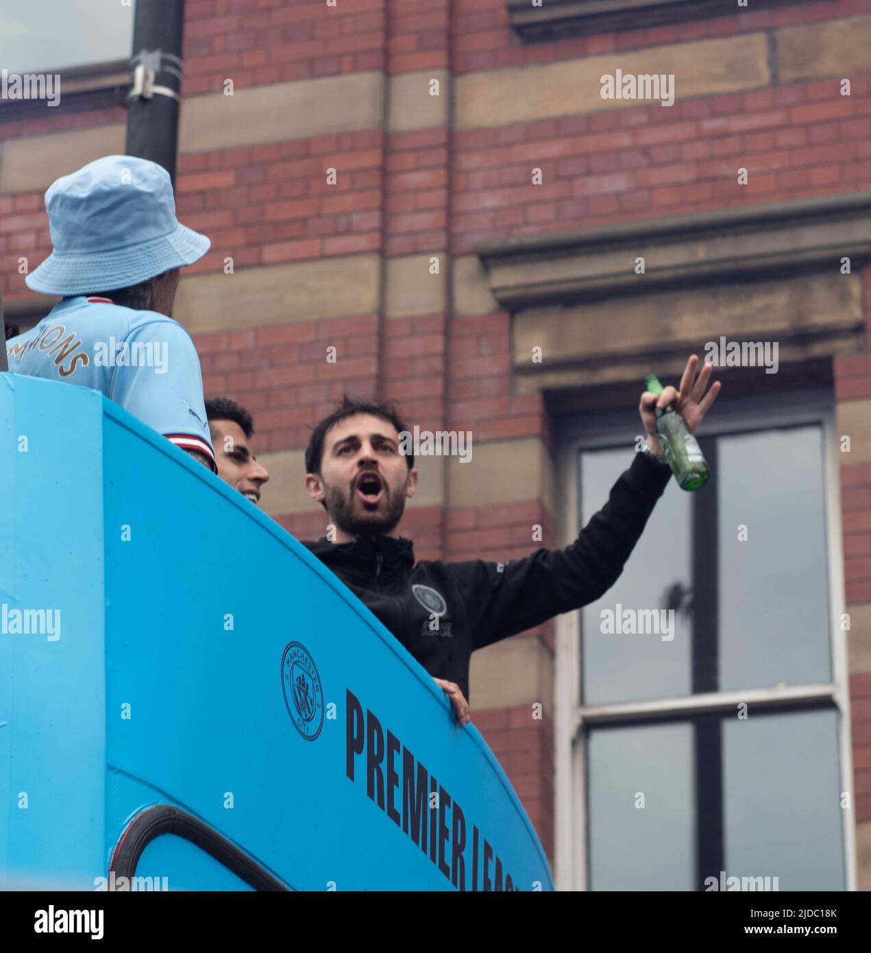 Bernado Silva celebrates winning the Premier League on the open top bus parade in Manchester Stock Photo