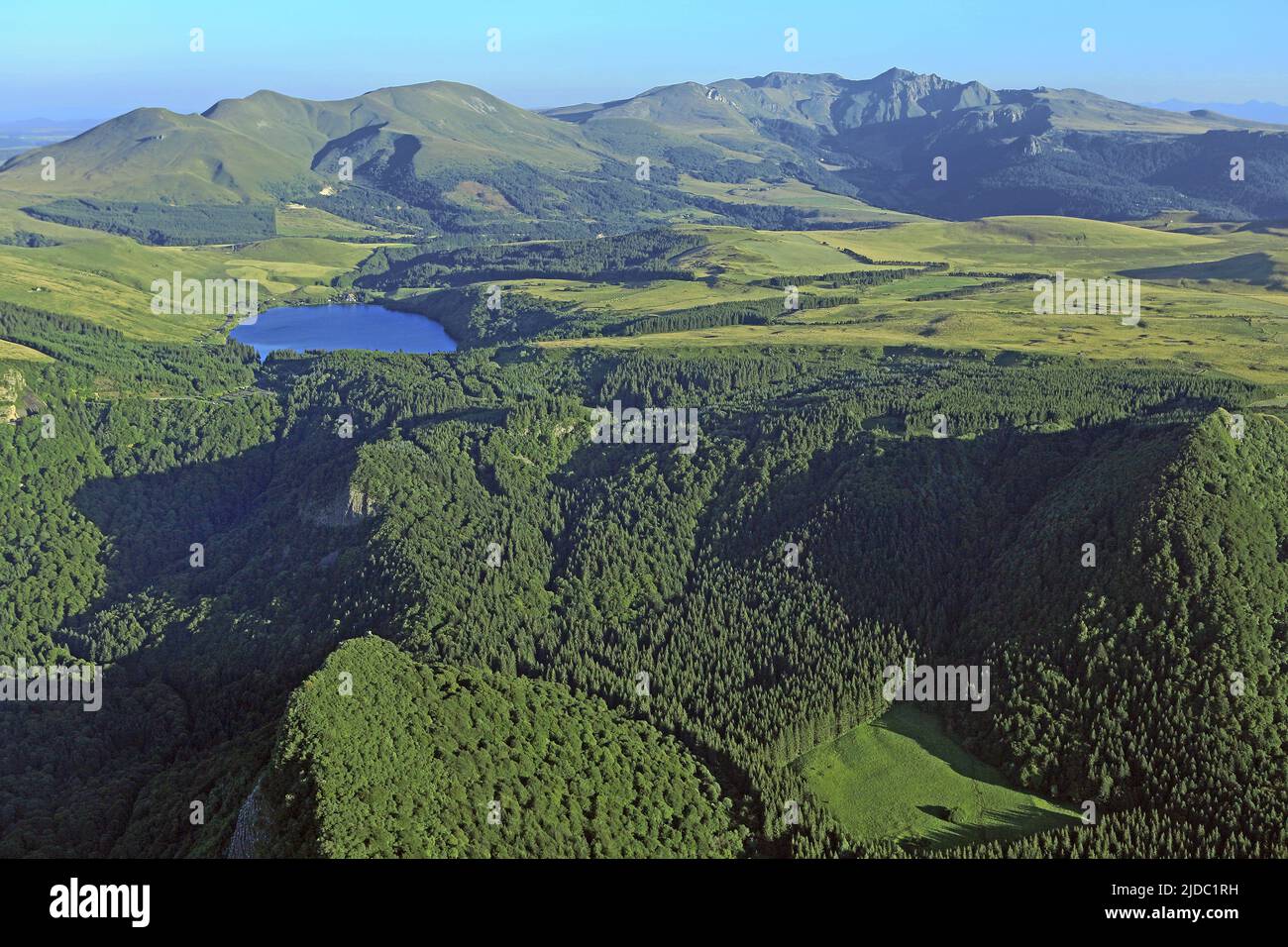 France, Puy-de-Dôme Lake Guéry mountain lake of volcanic origin located in the Massif des Monts Dore, the foreground rocks and Tuilières Sanadoire (aerial photo) Stock Photo