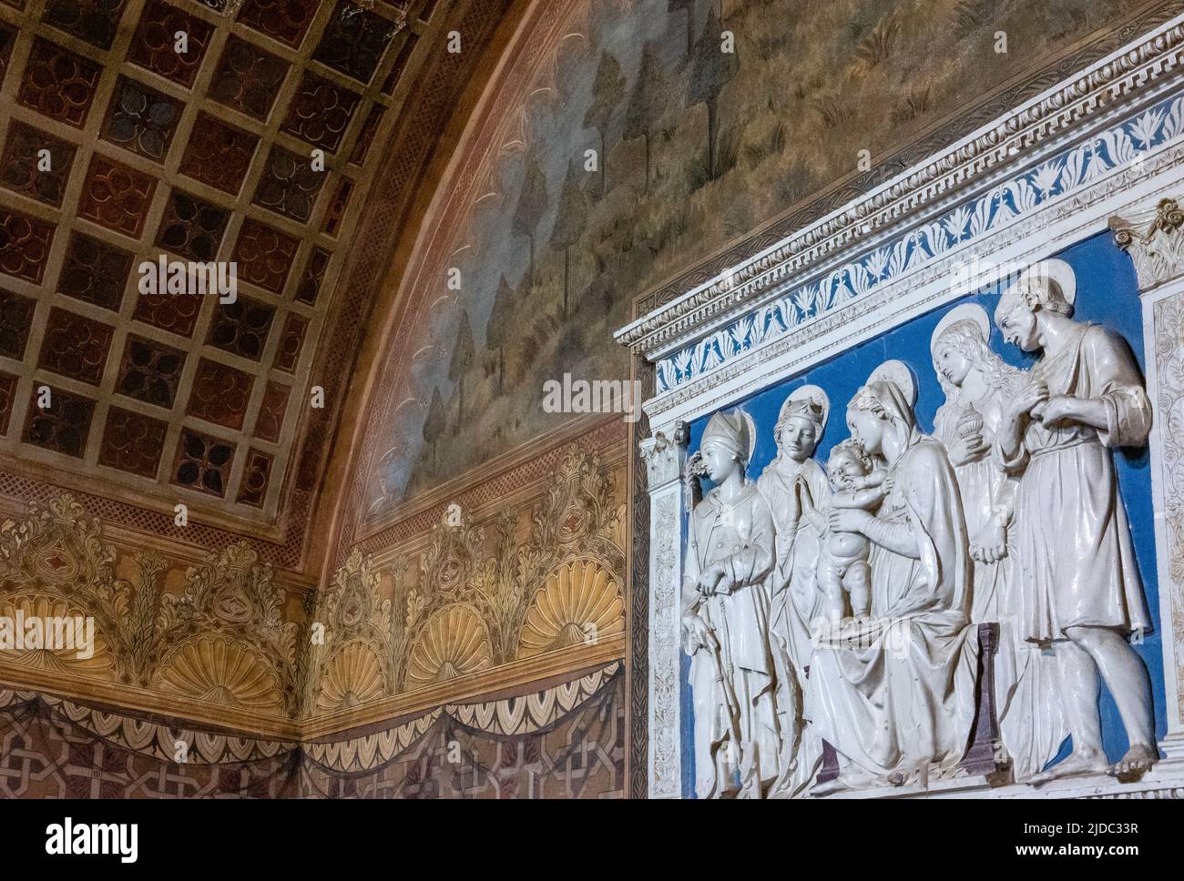 Gradara, Italy - May 29, 2018: The altarpiece by Luca Della Robbia in the chapel of the Malatesta Fortress Stock Photo