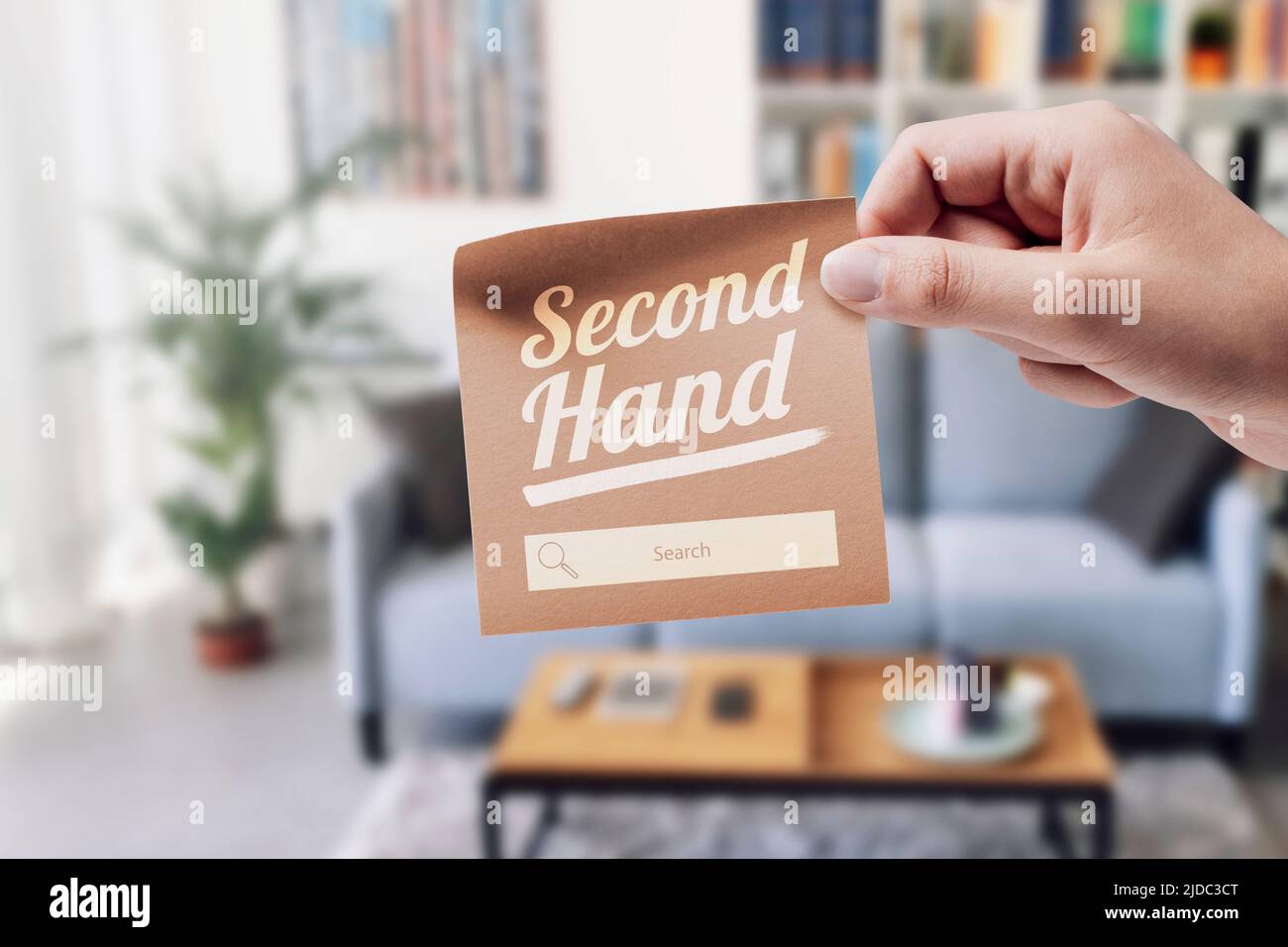 Woman holding a sticky note with "Second Hand" text and search bar, she
