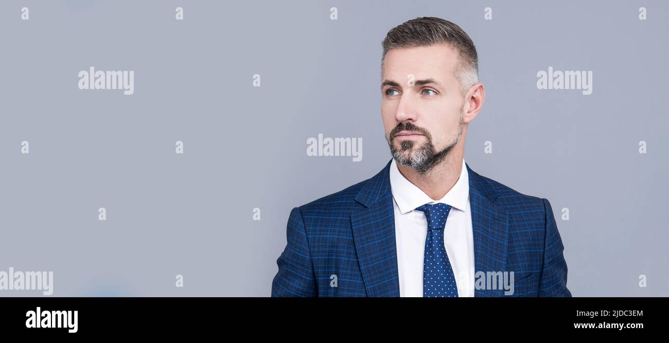 Mature businessman wear business suit in formal fashion style grey