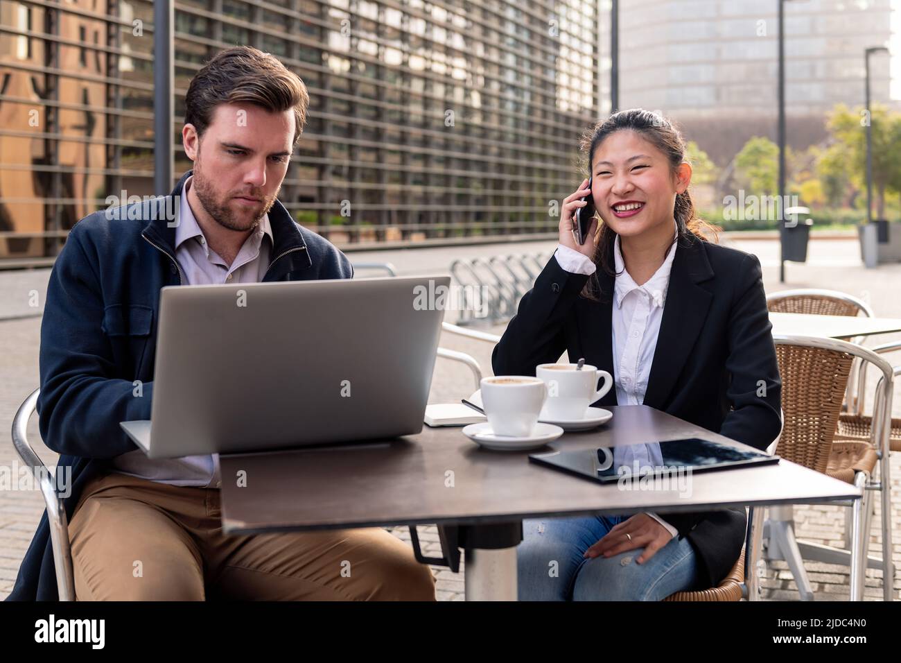 businesswoman working over coffee with a partner Stock Photo